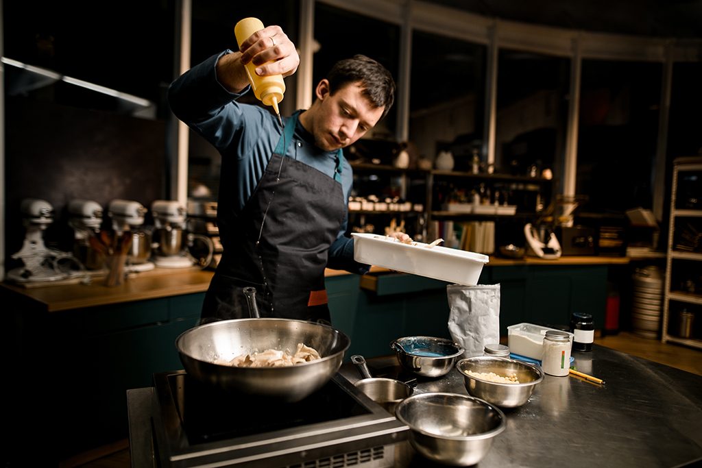 chef cooking with Hedgehog mushrooms