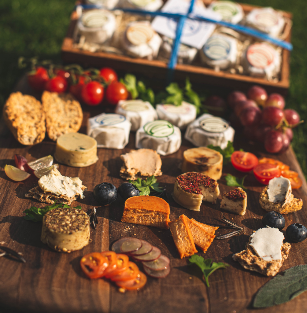 An array of vegan cheases, and other accompaniments.